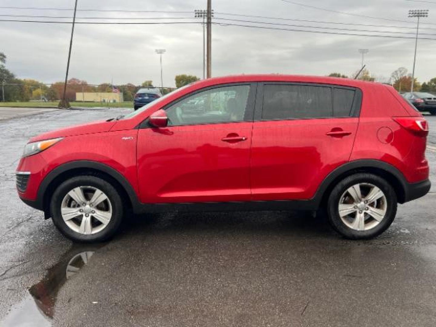 2012 Signal Red Metallic Kia Sportage LX AWD (KNDPBCA27C7) with an 2.4L V6 DOHC 24V engine, 6-Speed Automatic transmission, located at 1230 East Main St, Xenia, OH, 45385, (937) 908-9800, 39.688026, -83.910172 - Photo#3