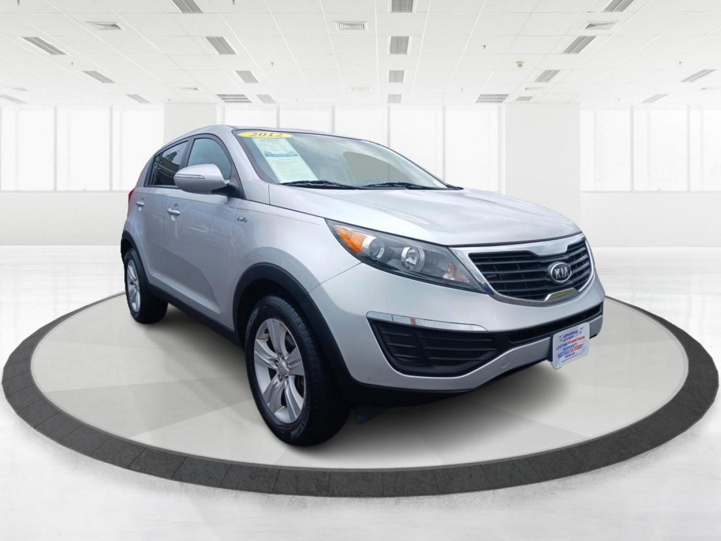 2012 Bright Silver Kia Sportage (KNDPBCA29C7) with an 2.4L V6 DOHC 24V engine, 6-Speed Automatic transmission, located at 1099 N County Rd 25A, Troy, OH, 45373, (937) 908-9800, 40.057079, -84.212883 - Photo#0