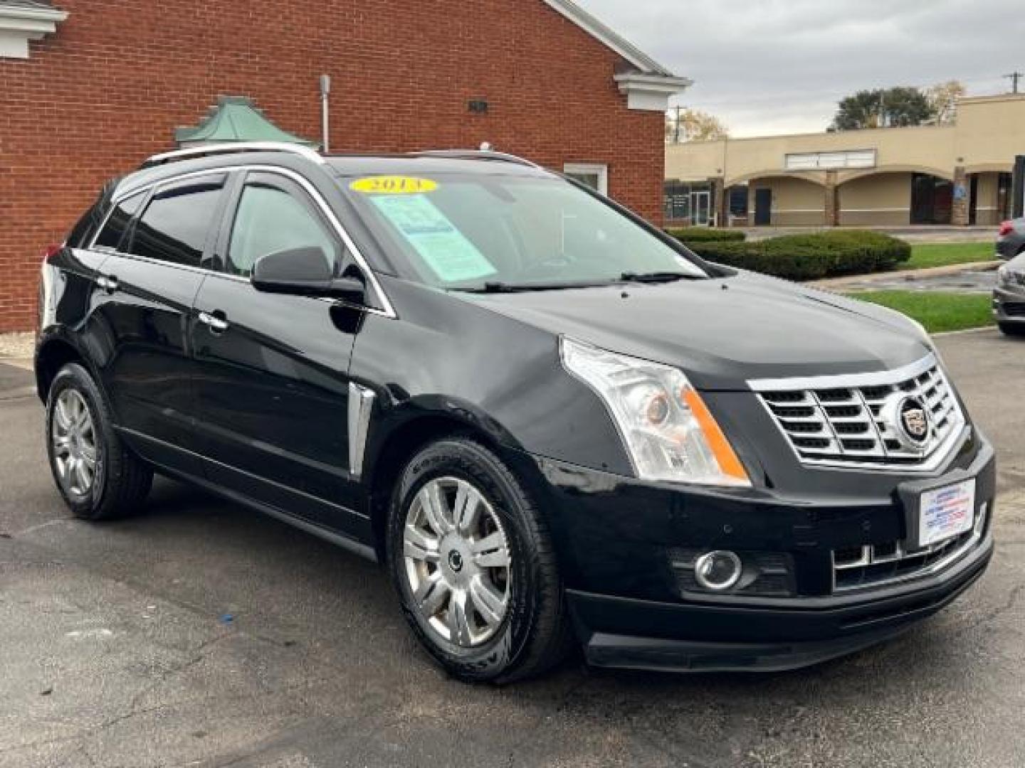 2013 Black Raven Cadillac SRX AWD Luxury Collection (3GYFNGE36DS) with an 3.6L V6 DOHC 24V FFV engine, 6-Speed Automatic transmission, located at 1099 N County Rd 25A, Troy, OH, 45373, (937) 908-9800, 40.057079, -84.212883 - Photo#0