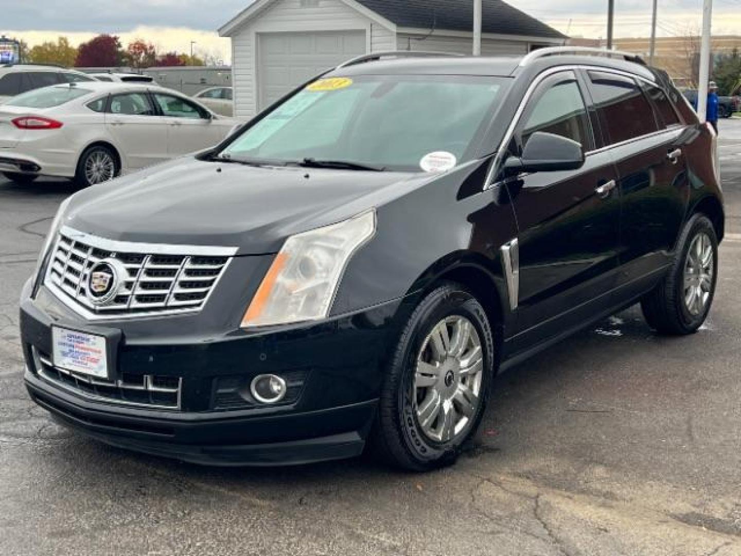 2013 Black Raven Cadillac SRX AWD Luxury Collection (3GYFNGE36DS) with an 3.6L V6 DOHC 24V FFV engine, 6-Speed Automatic transmission, located at 1099 N County Rd 25A, Troy, OH, 45373, (937) 908-9800, 40.057079, -84.212883 - Photo#2