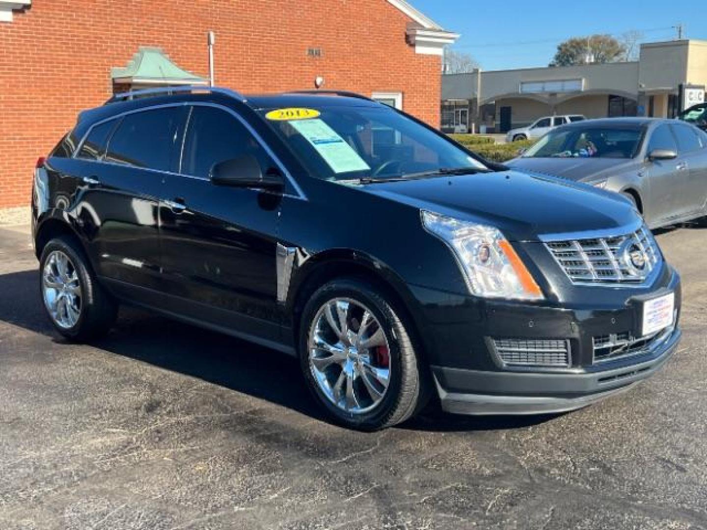 2013 Black Raven Cadillac SRX Luxury Collection (3GYFNCE36DS) with an 3.6L V6 DOHC 24V FFV engine, 6-Speed Automatic transmission, located at 1099 N County Rd 25A, Troy, OH, 45373, (937) 908-9800, 40.057079, -84.212883 - Photo#0