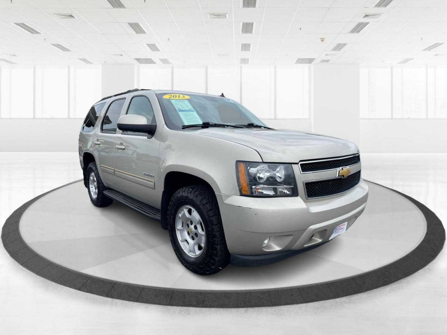 2013 Champagne Silver Metallic Chevrolet Tahoe (1GNSKBE03DR) with an 5.3L V8 OHV 16V FFV engine, 6-Speed Automatic transmission, located at 1230 East Main St, Xenia, OH, 45385, (937) 908-9800, 39.688026, -83.910172 - Photo#0