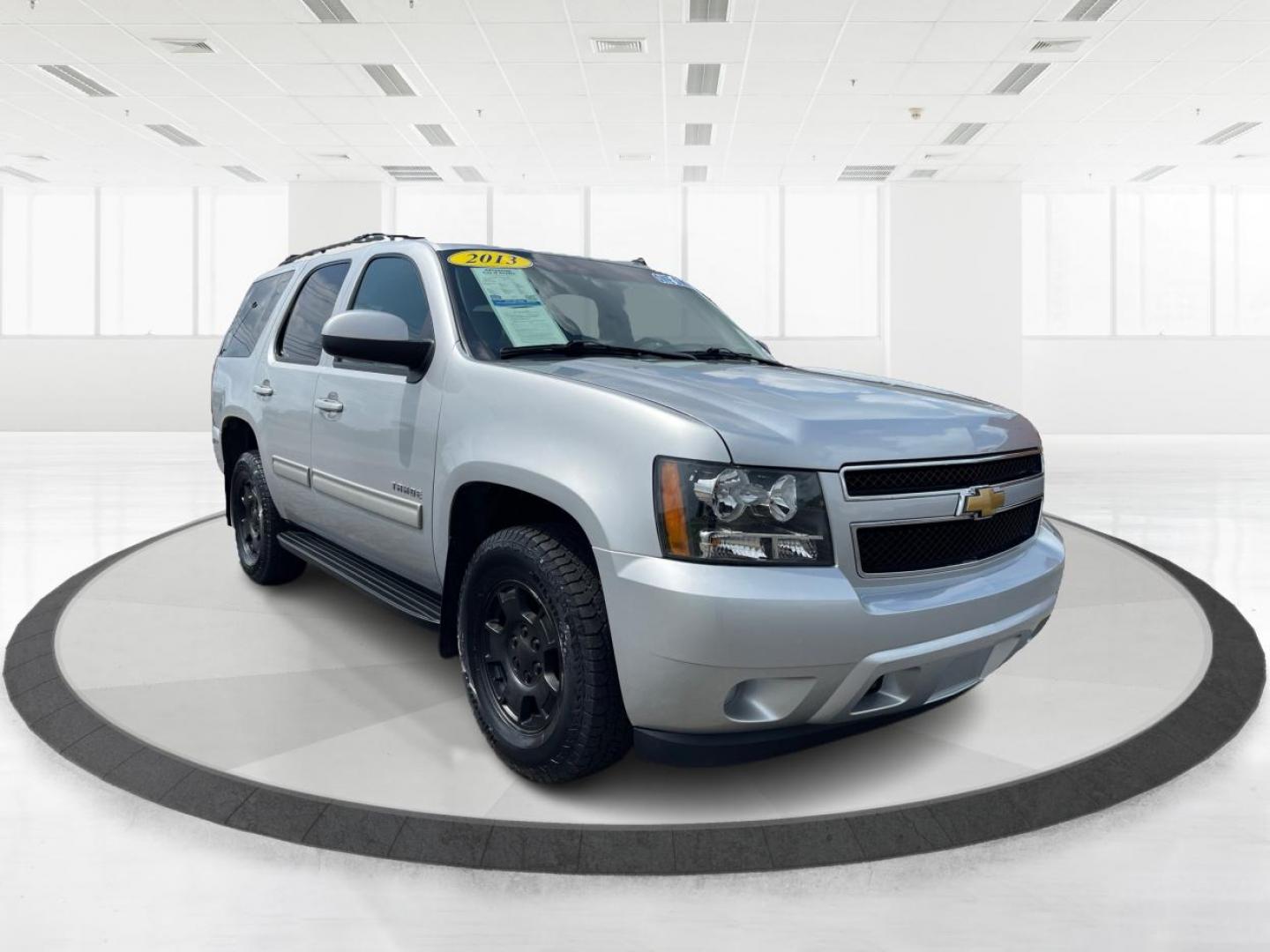 2013 Silver Ice Metallic Chevrolet Tahoe (1GNSKAE04DR) with an 5.3L V8 OHV 16V FFV engine, 6-Speed Automatic transmission, located at 1184 Kauffman Ave, Fairborn, OH, 45324, (937) 908-9800, 39.807072, -84.030914 - Photo#0