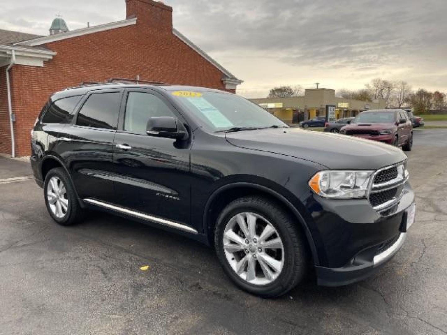 2013 Brilliant Black Crystal Pearl Dodge Durango Crew AWD (1C4RDJDG4DC) with an 3.6L V6 DOHC 24V engine, 5-Speed Automatic transmission, located at 1099 N County Rd 25A, Troy, OH, 45373, (937) 908-9800, 40.057079, -84.212883 - Photo#0