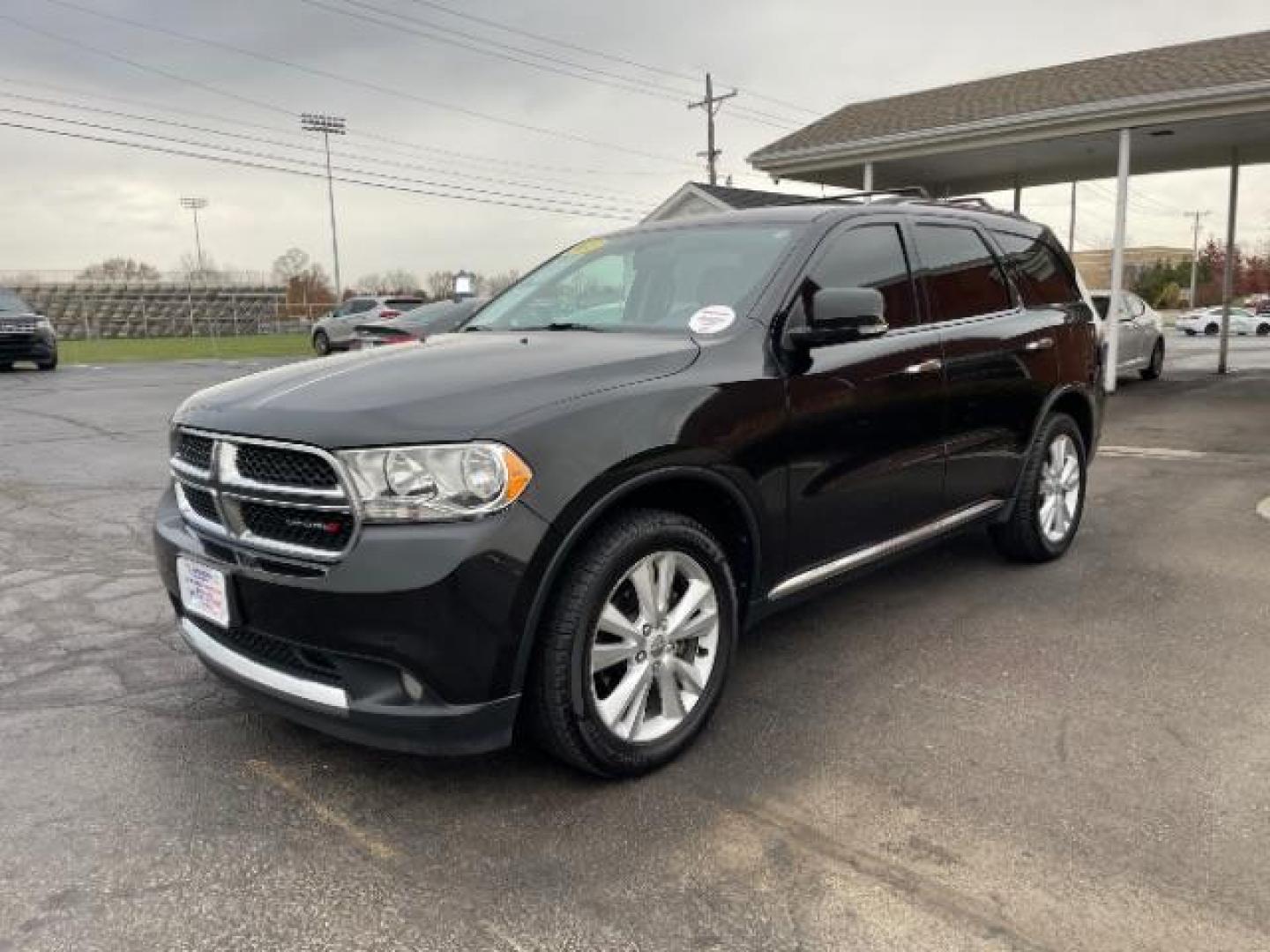 2013 Brilliant Black Crystal Pearl Dodge Durango Crew AWD (1C4RDJDG4DC) with an 3.6L V6 DOHC 24V engine, 5-Speed Automatic transmission, located at 1099 N County Rd 25A, Troy, OH, 45373, (937) 908-9800, 40.057079, -84.212883 - Photo#1