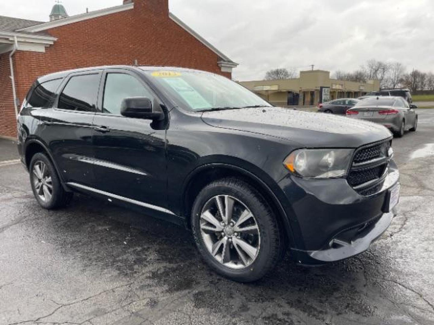 2013 Brilliant Black Crystal Pearl Dodge Durango SXT AWD (1C4RDJAG2DC) with an 3.6L V6 DOHC 24V engine, 5-Speed Automatic transmission, located at 1099 N County Rd 25A, Troy, OH, 45373, (937) 908-9800, 40.057079, -84.212883 - Photo#0