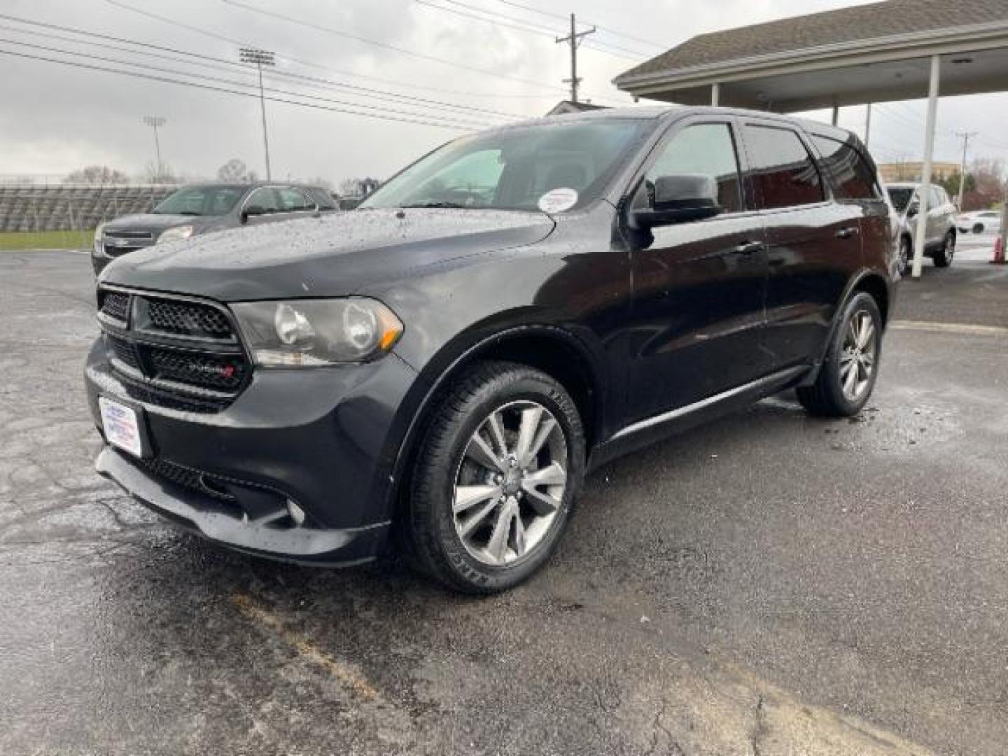 2013 Brilliant Black Crystal Pearl Dodge Durango SXT AWD (1C4RDJAG2DC) with an 3.6L V6 DOHC 24V engine, 5-Speed Automatic transmission, located at 1099 N County Rd 25A, Troy, OH, 45373, (937) 908-9800, 40.057079, -84.212883 - Photo#1