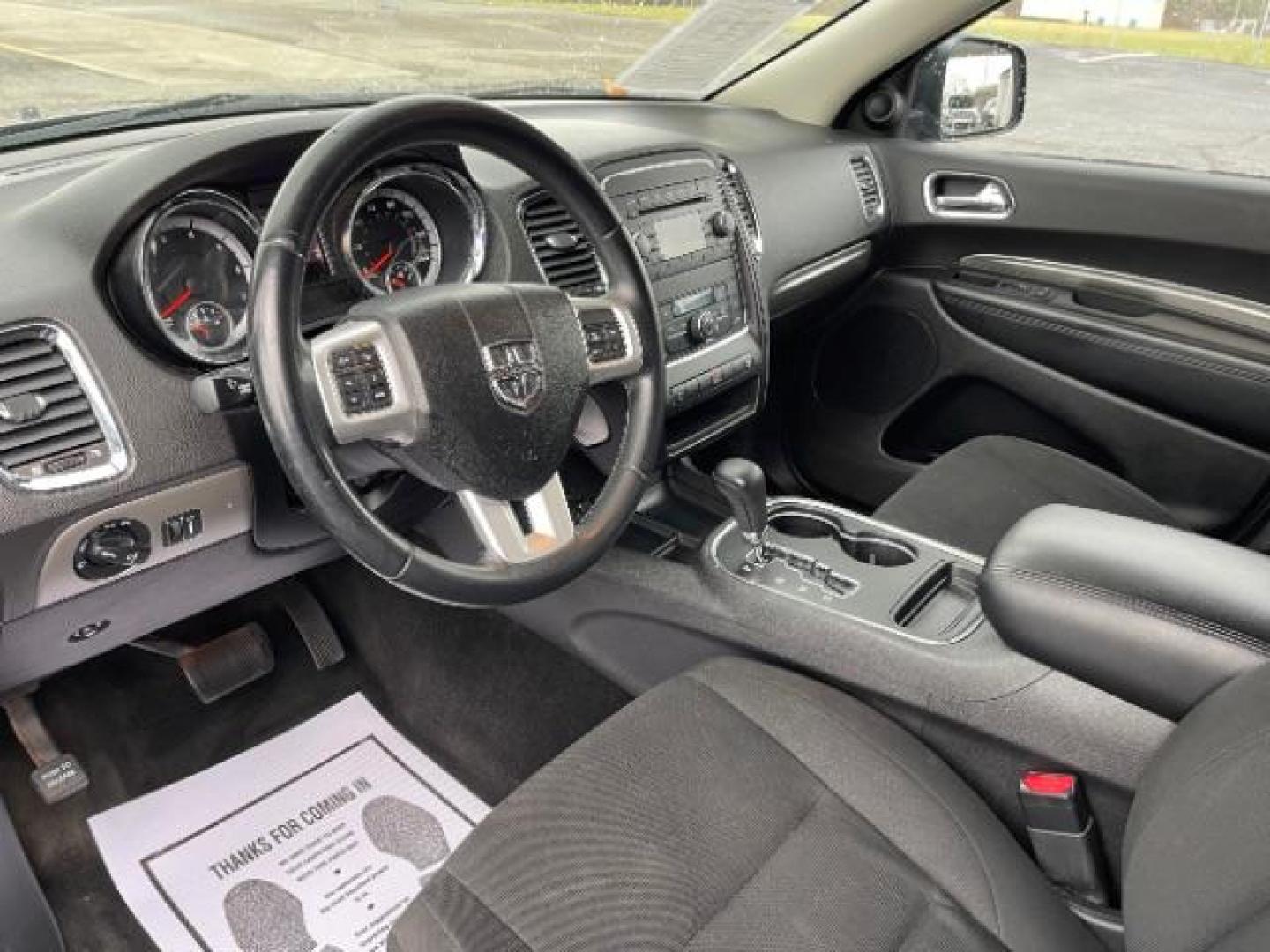 2013 Brilliant Black Crystal Pearl Dodge Durango SXT AWD (1C4RDJAG2DC) with an 3.6L V6 DOHC 24V engine, 5-Speed Automatic transmission, located at 1099 N County Rd 25A, Troy, OH, 45373, (937) 908-9800, 40.057079, -84.212883 - Photo#6