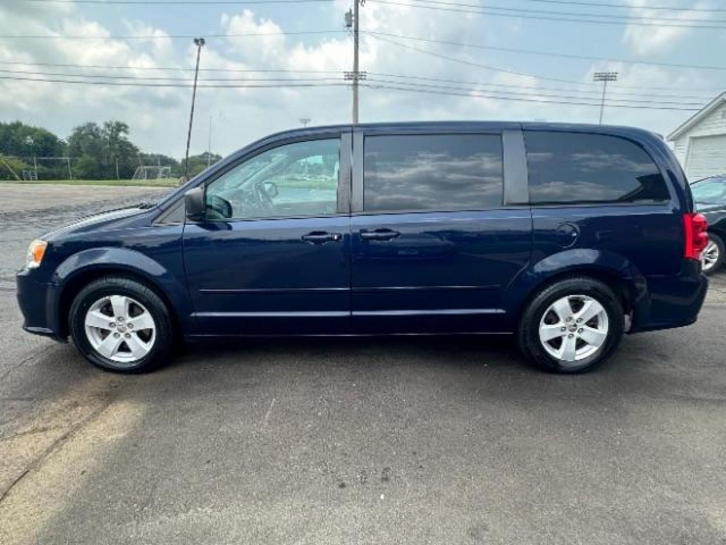 2013 Blue Streak Pearl Dodge Grand Caravan SE (2C4RDGBG1DR) with an 3.6L V6 DOHC 24V engine, 6-Speed Automatic transmission, located at 401 Woodman Dr, Riverside, OH, 45431, (937) 908-9800, 39.760899, -84.123421 - Photo#3