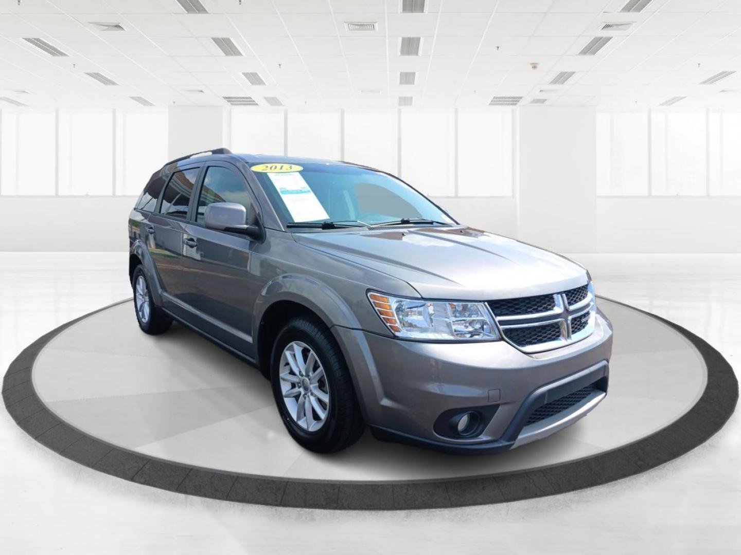 2013 Storm Grey Pearl Dodge Journey SXT (3C4PDCBB2DT) with an 2.4L L6 DOHC 16V engine, 4-Speed Automatic transmission, located at 1184 Kauffman Ave, Fairborn, OH, 45324, (937) 908-9800, 39.807072, -84.030914 - Photo#0