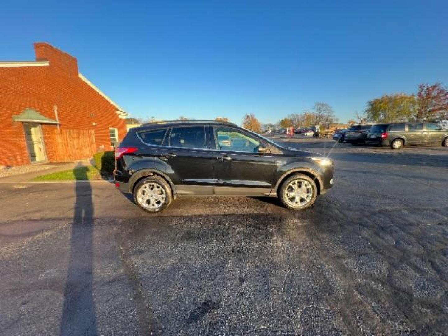 2013 Tuxedo Black Ford Escape SEL 4WD (1FMCU9H95DU) with an 2.0L L4 DOHC 16V engine, 6-Speed Automatic transmission, located at 401 Woodman Dr, Riverside, OH, 45431, (937) 908-9800, 39.760899, -84.123421 - Photo#5