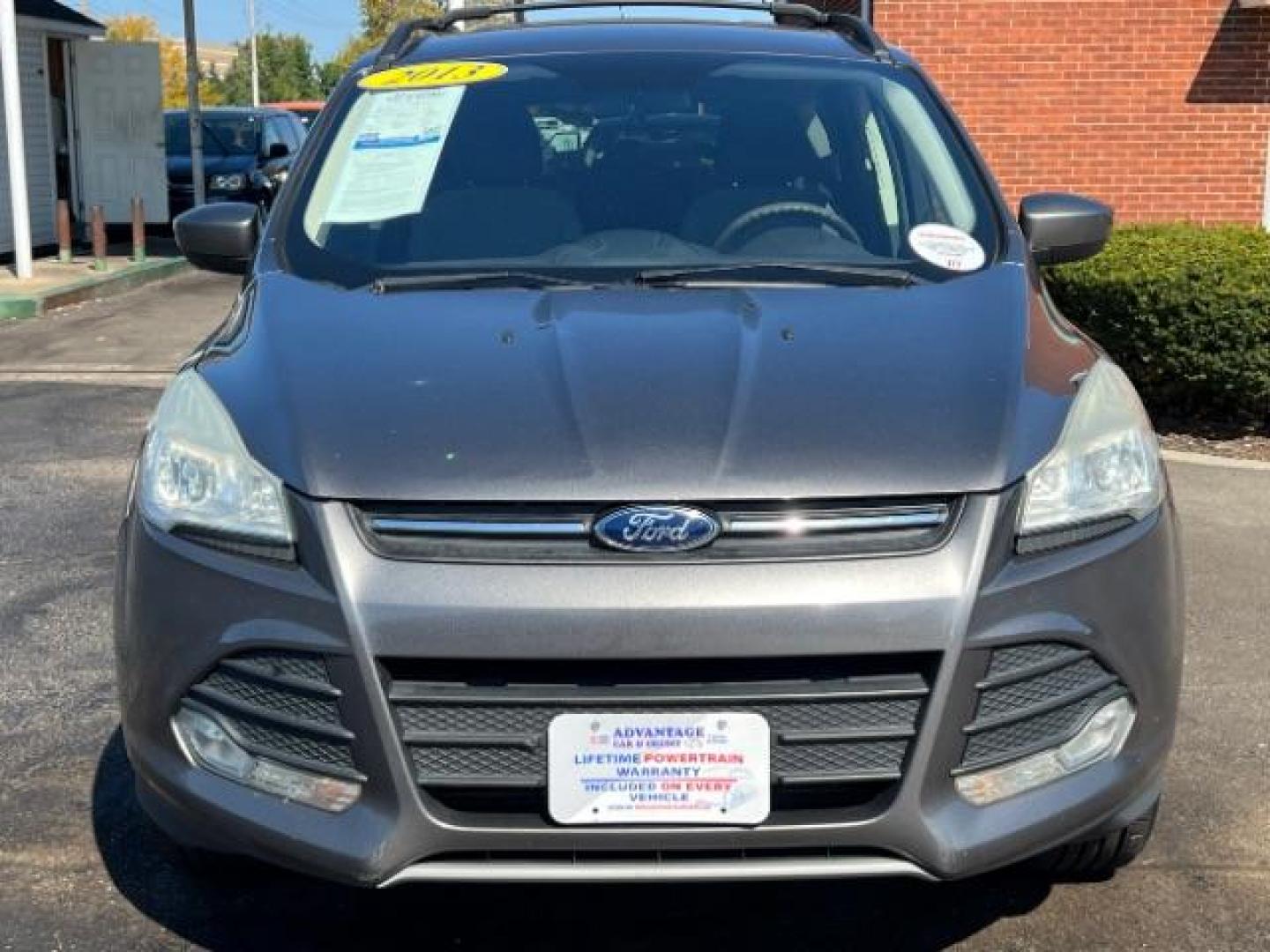 2013 Sterling Grey Metallic Ford Escape SE 4WD (1FMCU9G92DU) with an 2.0L L4 DOHC 16V engine, 6-Speed Automatic transmission, located at 4508 South Dixie Dr, Moraine, OH, 45439, (937) 908-9800, 39.689976, -84.218452 - Photo#1