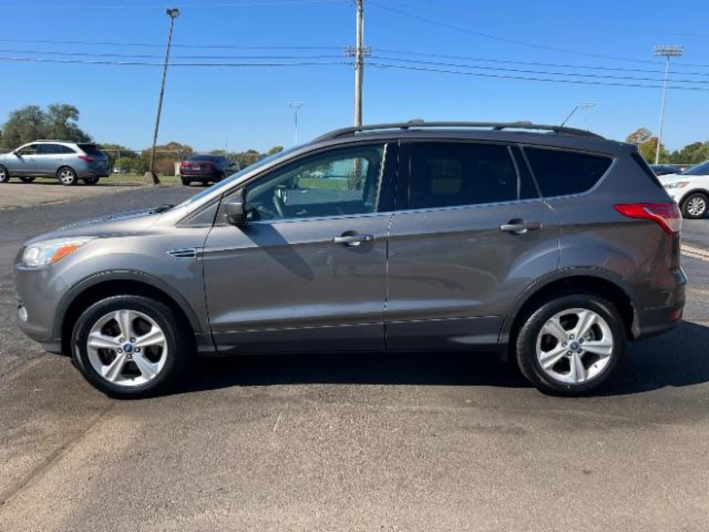 2013 Sterling Grey Metallic Ford Escape SE 4WD (1FMCU9G92DU) with an 2.0L L4 DOHC 16V engine, 6-Speed Automatic transmission, located at 4508 South Dixie Dr, Moraine, OH, 45439, (937) 908-9800, 39.689976, -84.218452 - Photo#3