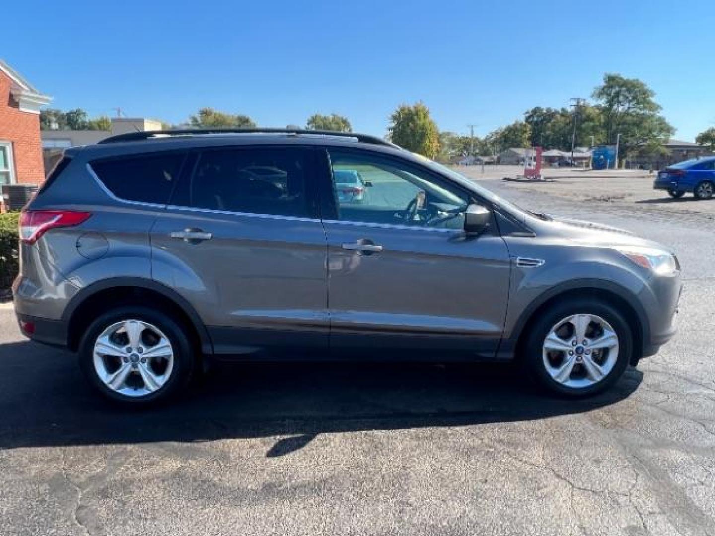 2013 Sterling Grey Metallic Ford Escape SE 4WD (1FMCU9G92DU) with an 2.0L L4 DOHC 16V engine, 6-Speed Automatic transmission, located at 4508 South Dixie Dr, Moraine, OH, 45439, (937) 908-9800, 39.689976, -84.218452 - Photo#5