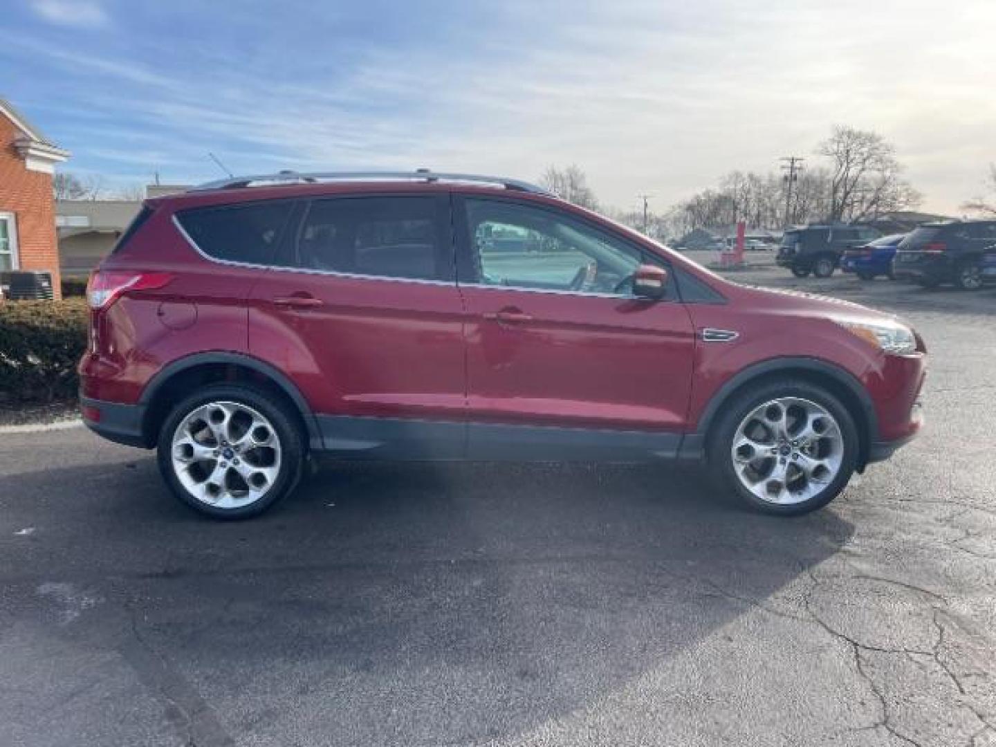 2013 Ruby Red Metallic Tinted Ford Escape Titanium 4WD (1FMCU9J92DU) with an 2.0L L4 DOHC 16V engine, 6-Speed Automatic transmission, located at 880 E. National Road, Vandalia, OH, 45377, (937) 908-9800, 39.891918, -84.183594 - Photo#5