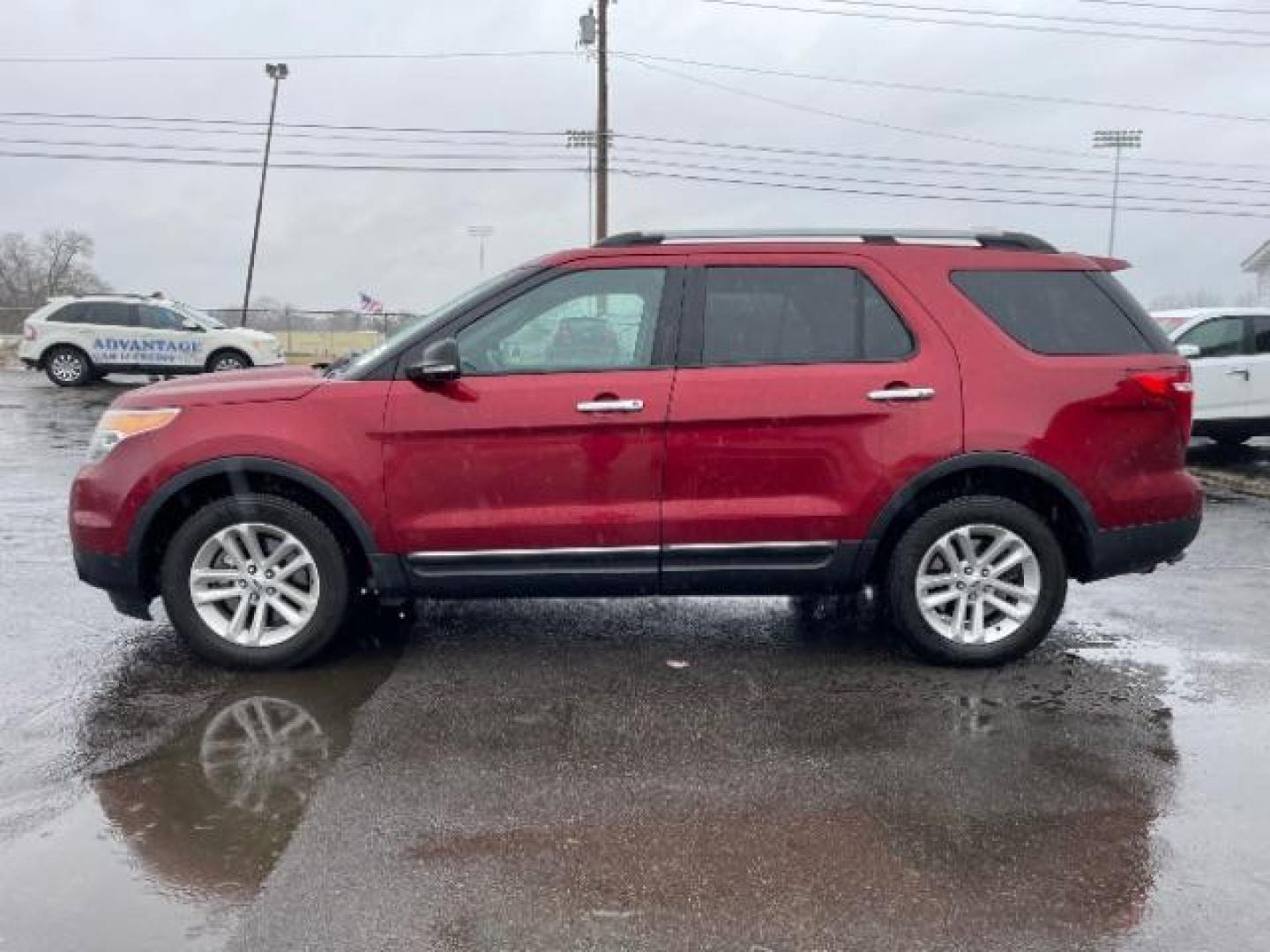 2013 Ruby Red Metallic Ford Explorer XLT 4WD (1FM5K8D83DG) with an 3.5L V6 DOHC 24V engine, 6-Speed Automatic transmission, located at 1099 N County Rd 25A, Troy, OH, 45373, (937) 908-9800, 40.057079, -84.212883 - Photo#2