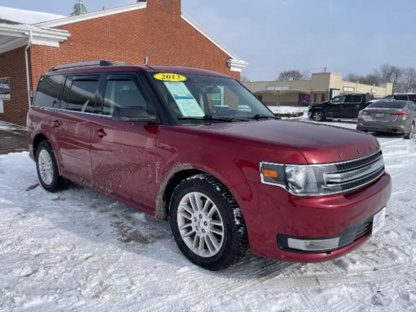 2013 Ruby Red Metallic Tinted Ford Flex SEL FWD (2FMGK5C84DB) with an 3.5L V6 DOHC 24V engine, 6-Speed Automatic Overdrive transmission, located at 1099 N County Rd 25A, Troy, OH, 45373, (937) 908-9800, 40.057079, -84.212883 - Photo#0