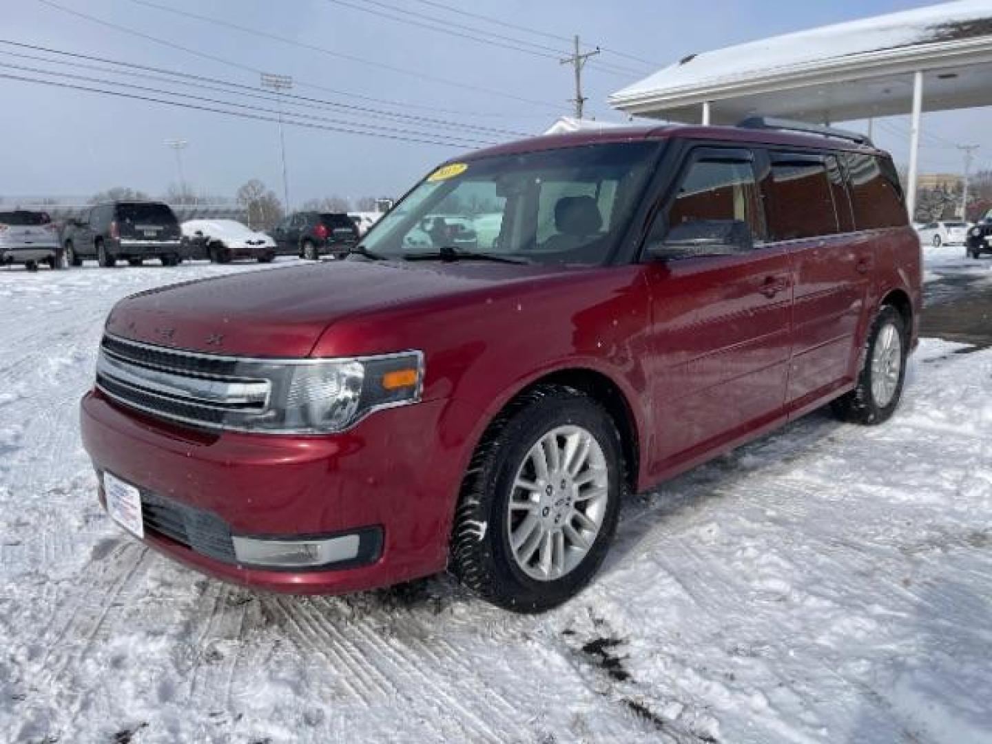 2013 Ruby Red Metallic Tinted Ford Flex SEL FWD (2FMGK5C84DB) with an 3.5L V6 DOHC 24V engine, 6-Speed Automatic Overdrive transmission, located at 1099 N County Rd 25A, Troy, OH, 45373, (937) 908-9800, 40.057079, -84.212883 - Photo#1