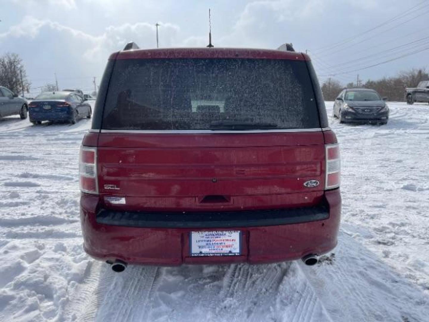 2013 Ruby Red Metallic Tinted Ford Flex SEL FWD (2FMGK5C84DB) with an 3.5L V6 DOHC 24V engine, 6-Speed Automatic Overdrive transmission, located at 1099 N County Rd 25A, Troy, OH, 45373, (937) 908-9800, 40.057079, -84.212883 - Photo#3