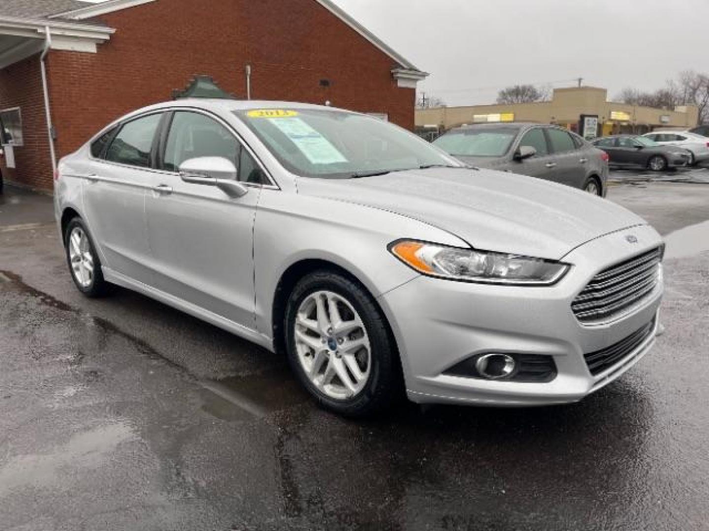 2013 Ingot Silver Ford Fusion SE (3FA6P0HR5DR) with an 1.6L L4 DOHC 16V engine, located at 1099 N County Rd 25A, Troy, OH, 45373, (937) 908-9800, 40.057079, -84.212883 - Photo#0