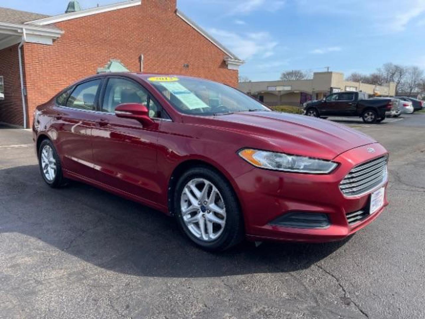 2013 Ruby Red Met Tinted CC Ford Fusion SE (3FA6P0H7XDR) with an 2.5L L4 DOHC 16V engine, located at 1099 N County Rd 25A, Troy, OH, 45373, (937) 908-9800, 40.057079, -84.212883 - Photo#0