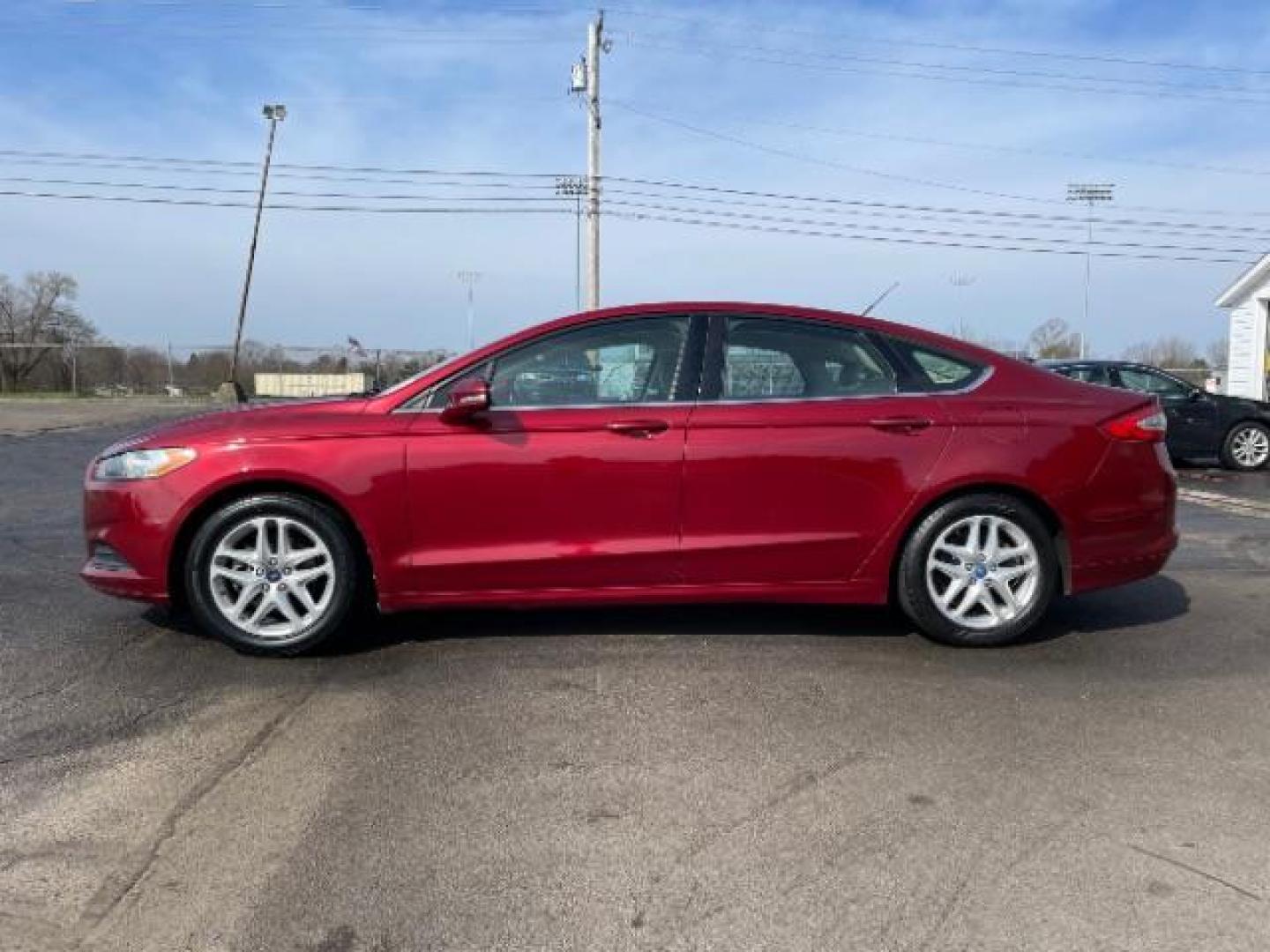 2013 Ruby Red Met Tinted CC Ford Fusion SE (3FA6P0H7XDR) with an 2.5L L4 DOHC 16V engine, located at 1099 N County Rd 25A, Troy, OH, 45373, (937) 908-9800, 40.057079, -84.212883 - Photo#2