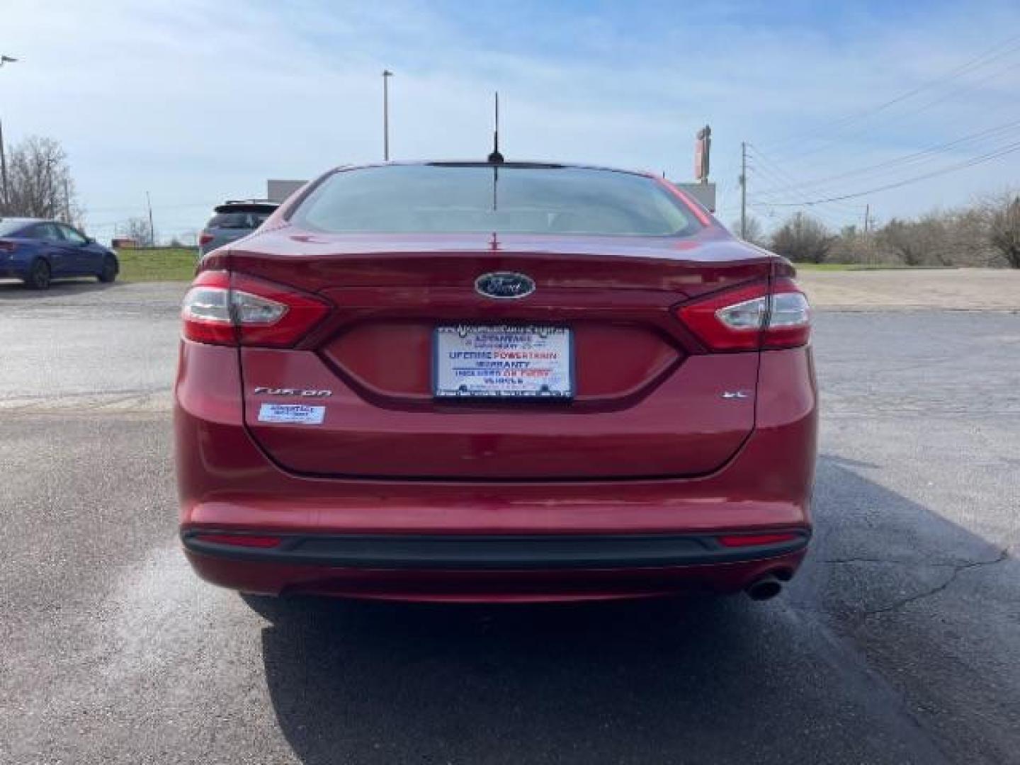 2013 Ruby Red Met Tinted CC Ford Fusion SE (3FA6P0H7XDR) with an 2.5L L4 DOHC 16V engine, located at 1099 N County Rd 25A, Troy, OH, 45373, (937) 908-9800, 40.057079, -84.212883 - Photo#4