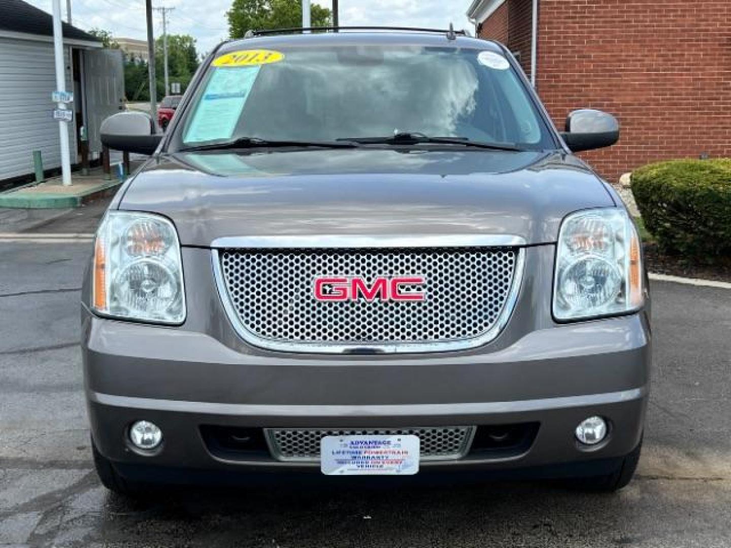 2013 Mocha Steel Metallic GMC Yukon Denali 4WD (1GKS2EEF1DR) with an 6.2L V8 OHV 16V engine, 6-Speed Automatic transmission, located at 4508 South Dixie Dr, Moraine, OH, 45439, (937) 908-9800, 39.689976, -84.218452 - Photo#1