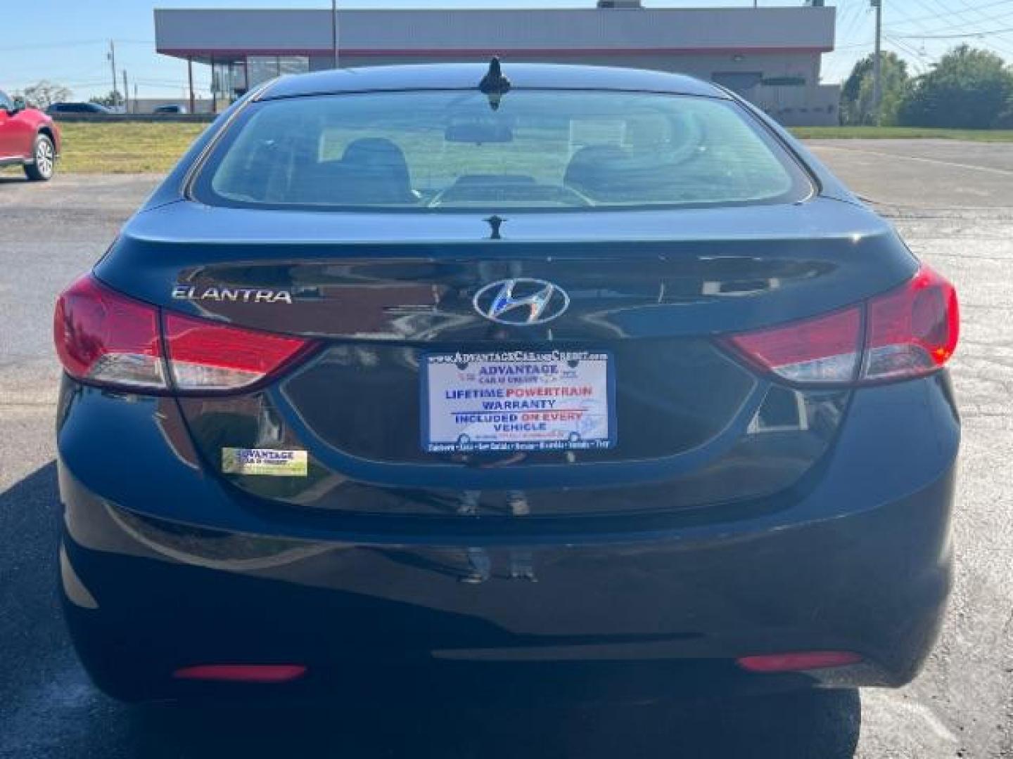 2013 Midnight Black Metallic Hyundai Elantra Limited (5NPDH4AE7DH) with an 1.8L L4 DOHC 16V engine, 6-Speed Automatic transmission, located at 1184 Kauffman Ave, Fairborn, OH, 45324, (937) 908-9800, 39.807072, -84.030914 - Photo#4