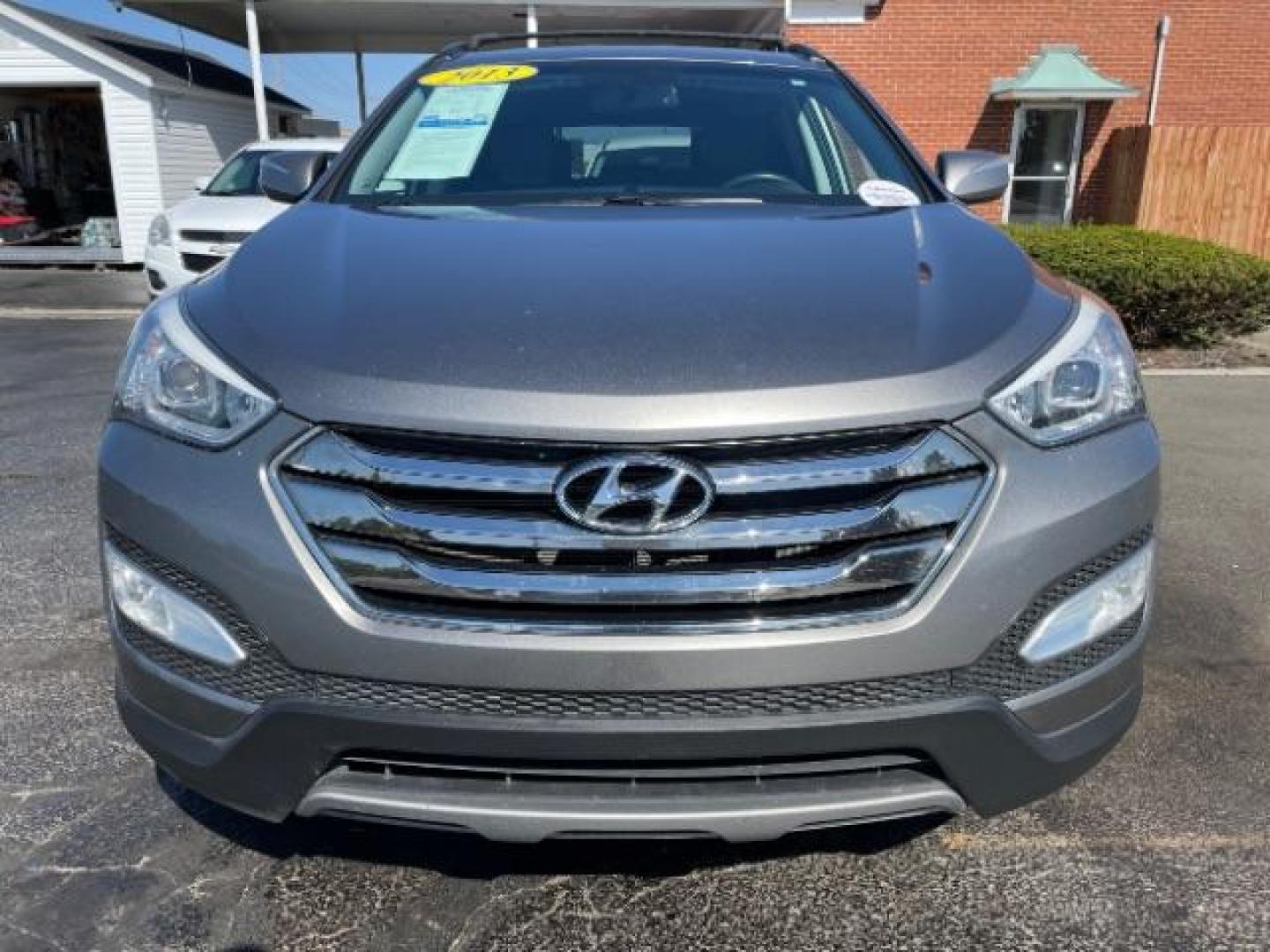 2013 Mineral Gray Hyundai Santa Fe Sport 2.0 FWD (5XYZU3LA8DG) with an 2.0L L4 DOHC 16V engine, 6-Speed Automatic transmission, located at 1184 Kauffman Ave, Fairborn, OH, 45324, (937) 908-9800, 39.807072, -84.030914 - Photo#2