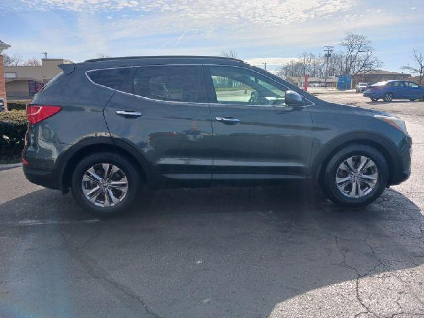 2013 Hyundai Santa Fe Sport 2.4 FWD (5XYZU3LB8DG) with an 2.4L L4 DOHC 16V engine, 6-Speed Automatic transmission, located at 1951 S Dayton Lakeview Rd., New Carlisle, OH, 45344, (937) 908-9800, 39.890999, -84.050255 - 2013 Hyundai Santa Fe Sport 2.4 FWD - Photo#4