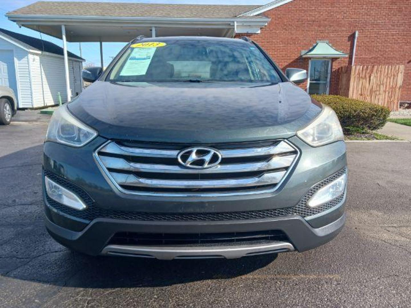 2013 Juniper Green Hyundai Santa Fe Sport 2.4 FWD (5XYZU3LB8DG) with an 2.4L L4 DOHC 16V engine, 6-Speed Automatic transmission, located at 1230 East Main St, Xenia, OH, 45385, (937) 908-9800, 39.688026, -83.910172 - Photo#2