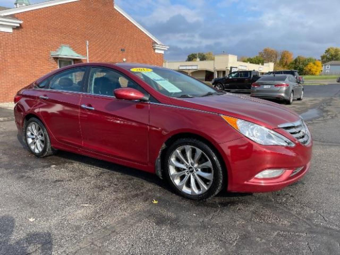 2013 Red Hyundai Sonata SE Auto (5NPEC4AC7DH) with an 2.4L L4 DOHC 16V engine, 6-Speed Automatic transmission, located at 4508 South Dixie Dr, Moraine, OH, 45439, (937) 908-9800, 39.689976, -84.218452 - Photo#0