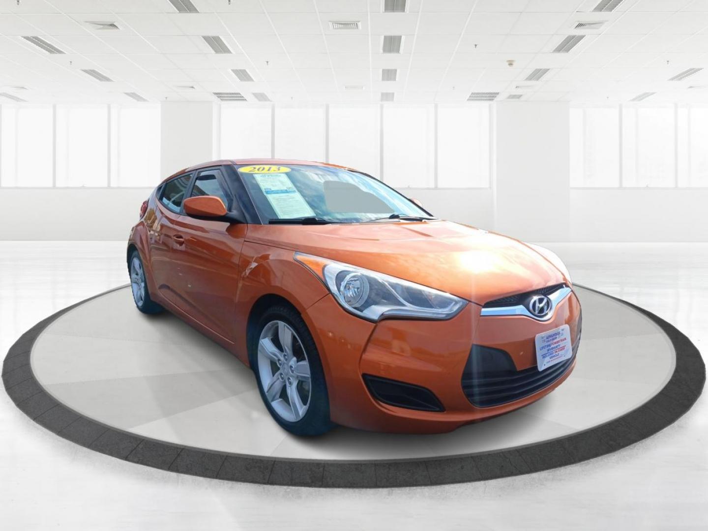 2013 Vitamin C Hyundai Veloster (KMHTC6AD8DU) with an 1.6L L4 DOHC 16V engine, located at 401 Woodman Dr, Riverside, OH, 45431, (937) 908-9800, 39.760899, -84.123421 - Photo#0