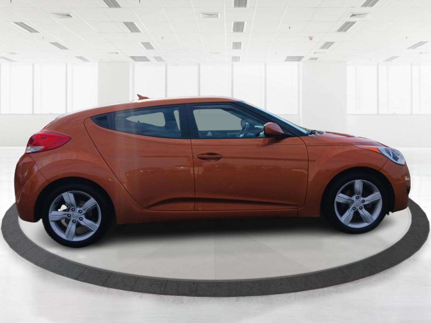 2013 Vitamin C Hyundai Veloster (KMHTC6AD8DU) with an 1.6L L4 DOHC 16V engine, located at 401 Woodman Dr, Riverside, OH, 45431, (937) 908-9800, 39.760899, -84.123421 - Photo#1