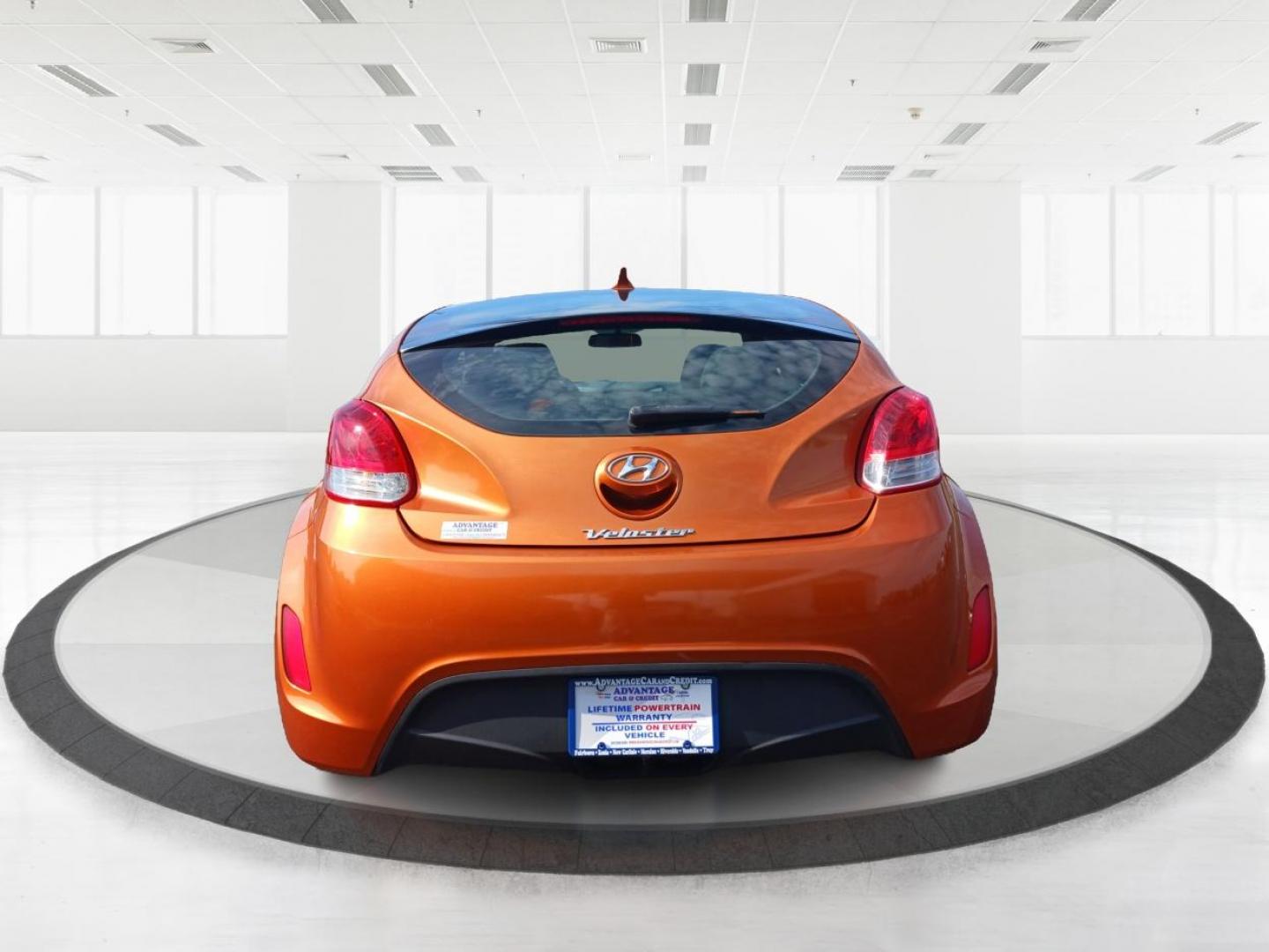 2013 Vitamin C Hyundai Veloster (KMHTC6AD8DU) with an 1.6L L4 DOHC 16V engine, located at 401 Woodman Dr, Riverside, OH, 45431, (937) 908-9800, 39.760899, -84.123421 - Photo#3