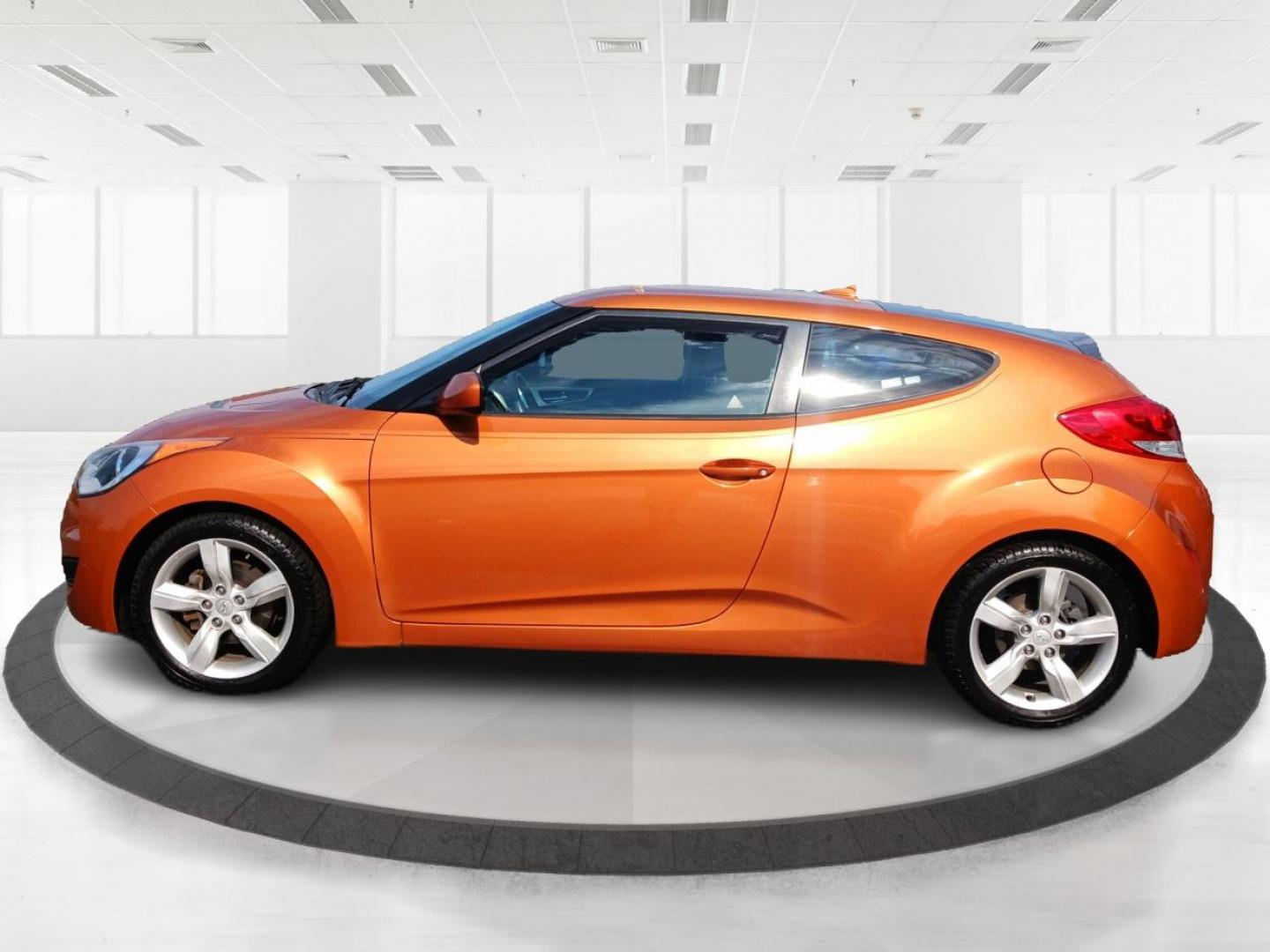 2013 Vitamin C Hyundai Veloster (KMHTC6AD8DU) with an 1.6L L4 DOHC 16V engine, located at 401 Woodman Dr, Riverside, OH, 45431, (937) 908-9800, 39.760899, -84.123421 - Photo#5