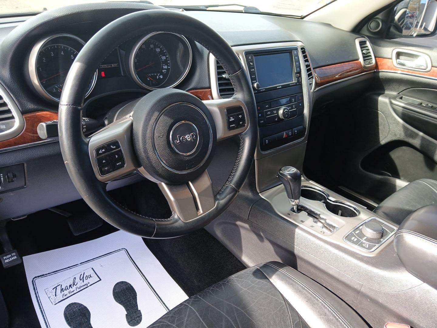 2013 Brilliant Black Crystal Pearl Jeep Grand Cherokee (1C4RJFBG1DC) with an 3.6L V6 DOHC 24V engine, 5-Speed Automatic transmission, located at 4508 South Dixie Dr, Moraine, OH, 45439, (937) 908-9800, 39.689976, -84.218452 - Photo#8