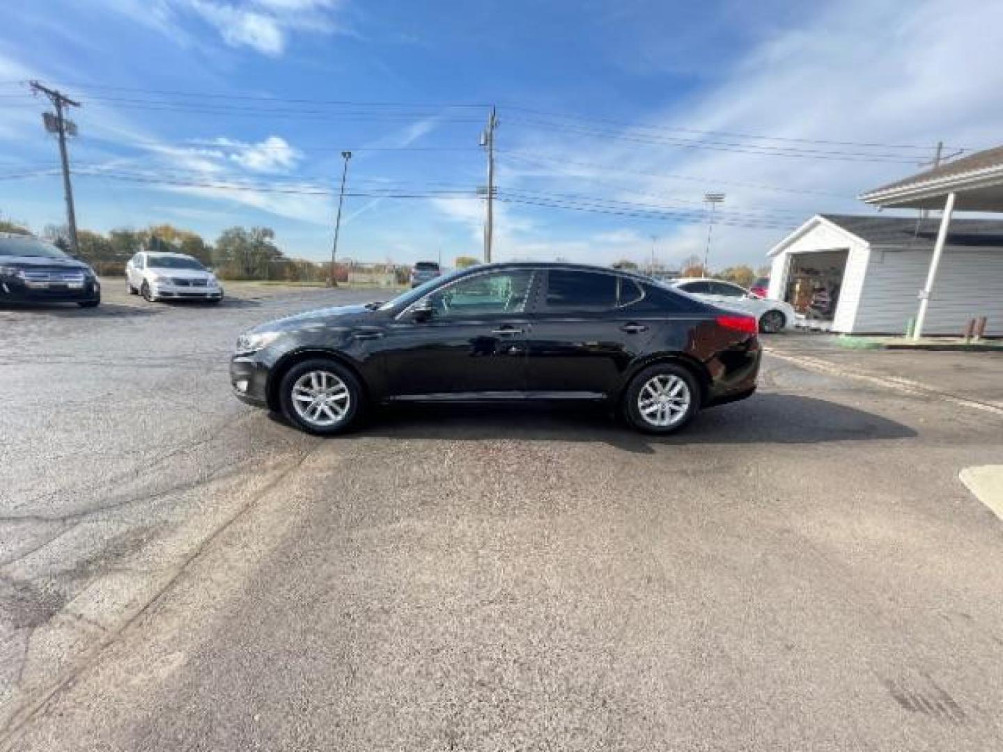 2013 Ebony Black Kia Optima LX AT (5XXGM4A7XDG) with an 2.4L L4 DOHC 16V engine, 6-Speed Automatic transmission, located at 1951 S Dayton Lakeview Rd., New Carlisle, OH, 45344, (937) 908-9800, 39.890999, -84.050255 - Photo#3