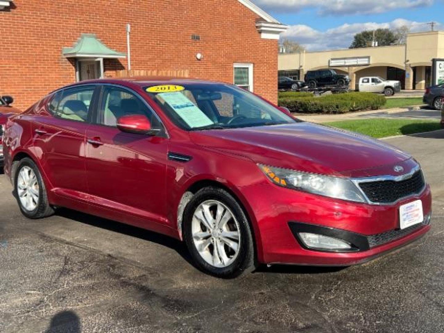 2013 Remington Red Metallic Kia Optima LX AT (5XXGM4A71DG) with an 2.4L L4 DOHC 16V engine, 6-Speed Automatic transmission, located at 1230 East Main St, Xenia, OH, 45385, (937) 908-9800, 39.688026, -83.910172 - Photo#0