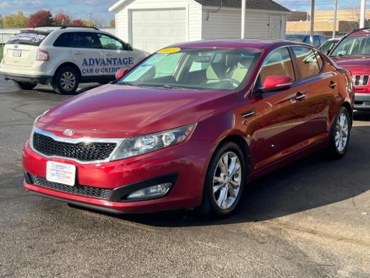 2013 Remington Red Metallic Kia Optima LX AT (5XXGM4A71DG) with an 2.4L L4 DOHC 16V engine, 6-Speed Automatic transmission, located at 1230 East Main St, Xenia, OH, 45385, (937) 908-9800, 39.688026, -83.910172 - Photo#2