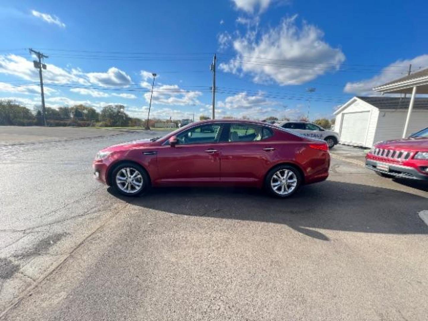 2013 Remington Red Metallic Kia Optima LX AT (5XXGM4A71DG) with an 2.4L L4 DOHC 16V engine, 6-Speed Automatic transmission, located at 1230 East Main St, Xenia, OH, 45385, (937) 908-9800, 39.688026, -83.910172 - Photo#3