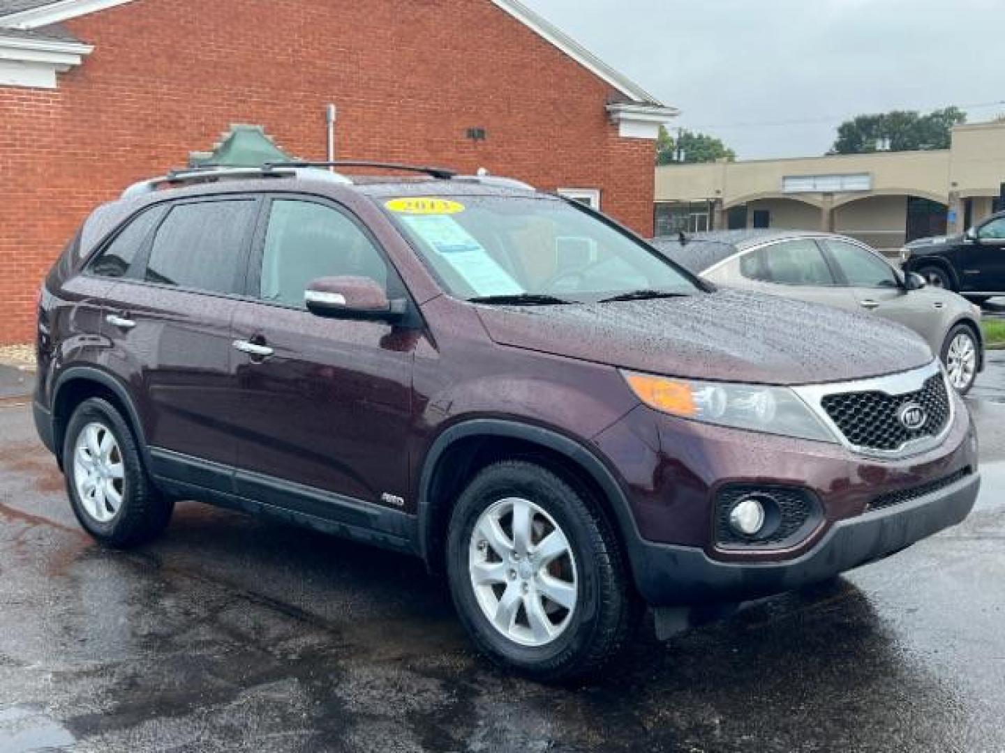 2013 Dark Cherry Kia Sorento LX 4WD (5XYKTDA67DG) with an 2.4L L4 DOHC 16V engine, 6-Speed Automatic transmission, located at 401 Woodman Dr, Riverside, OH, 45431, (937) 908-9800, 39.760899, -84.123421 - Photo#0