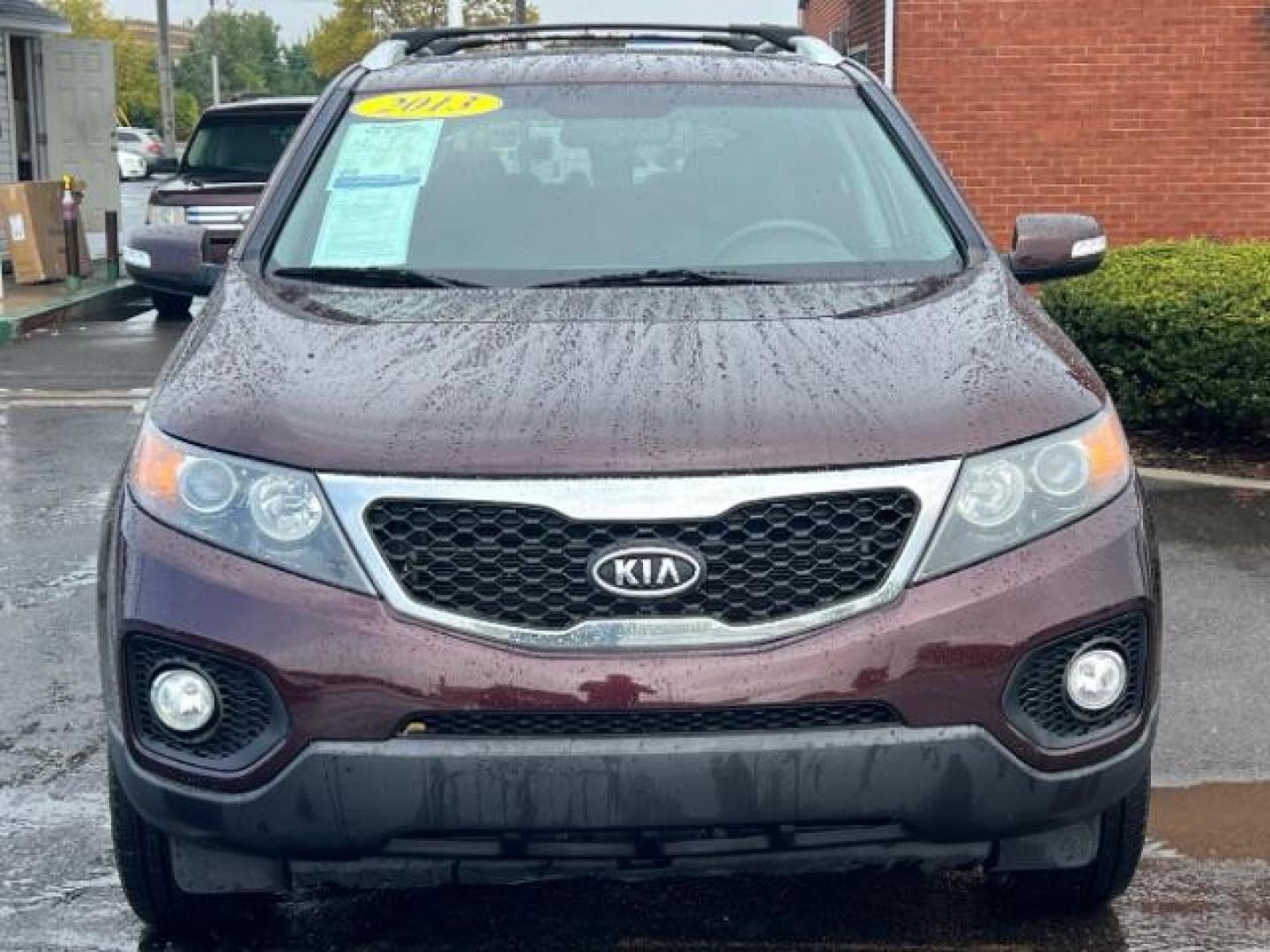 2013 Dark Cherry Kia Sorento LX 4WD (5XYKTDA67DG) with an 2.4L L4 DOHC 16V engine, 6-Speed Automatic transmission, located at 401 Woodman Dr, Riverside, OH, 45431, (937) 908-9800, 39.760899, -84.123421 - Photo#1