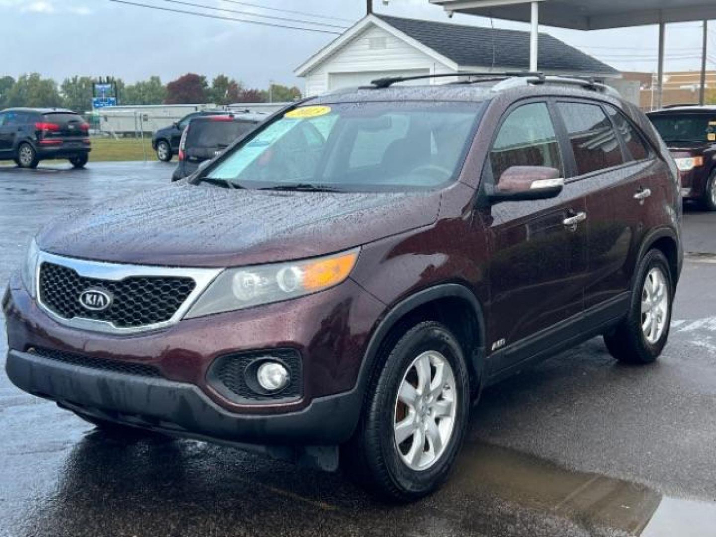 2013 Dark Cherry Kia Sorento LX 4WD (5XYKTDA67DG) with an 2.4L L4 DOHC 16V engine, 6-Speed Automatic transmission, located at 401 Woodman Dr, Riverside, OH, 45431, (937) 908-9800, 39.760899, -84.123421 - Photo#2