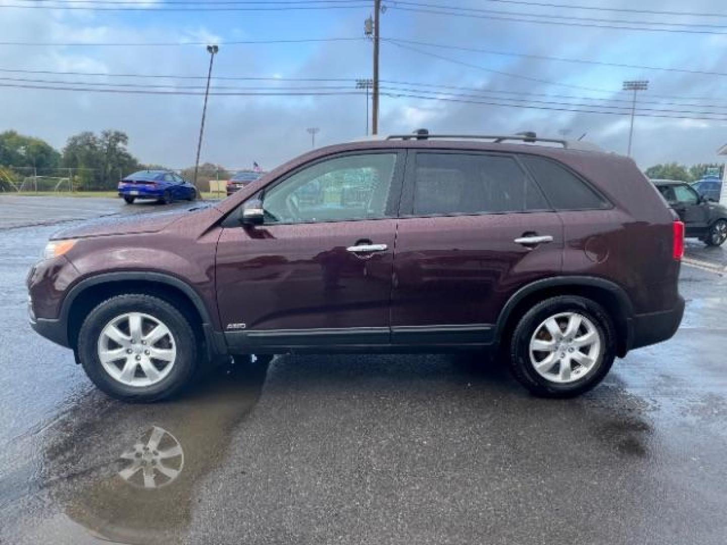 2013 Dark Cherry Kia Sorento LX 4WD (5XYKTDA67DG) with an 2.4L L4 DOHC 16V engine, 6-Speed Automatic transmission, located at 401 Woodman Dr, Riverside, OH, 45431, (937) 908-9800, 39.760899, -84.123421 - Photo#3