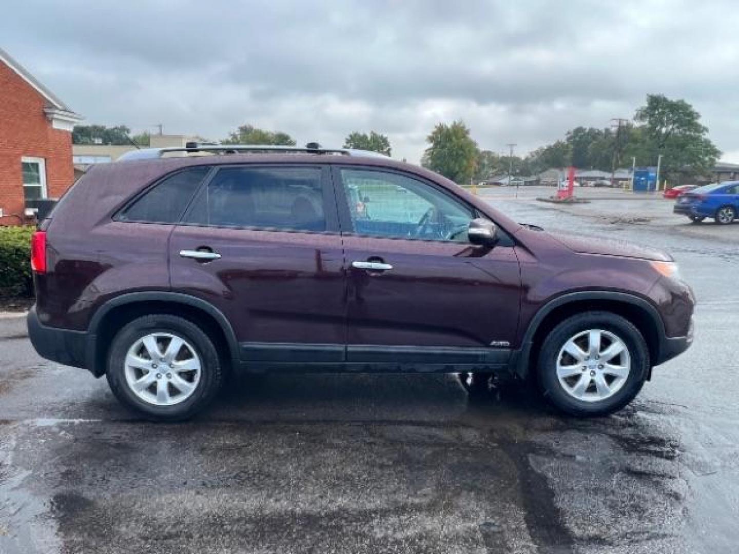 2013 Dark Cherry Kia Sorento LX 4WD (5XYKTDA67DG) with an 2.4L L4 DOHC 16V engine, 6-Speed Automatic transmission, located at 401 Woodman Dr, Riverside, OH, 45431, (937) 908-9800, 39.760899, -84.123421 - Photo#5