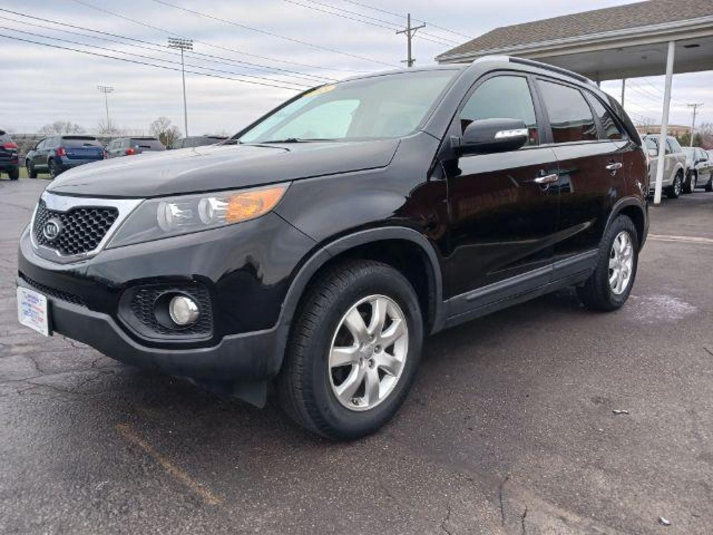 2013 Ebony Black Kia Sorento LX 2WD (5XYKT3A68DG) with an 2.4L L4 DOHC 16V engine, 6-Speed Automatic transmission, located at 401 Woodman Dr, Riverside, OH, 45431, (937) 908-9800, 39.760899, -84.123421 - Photo#2