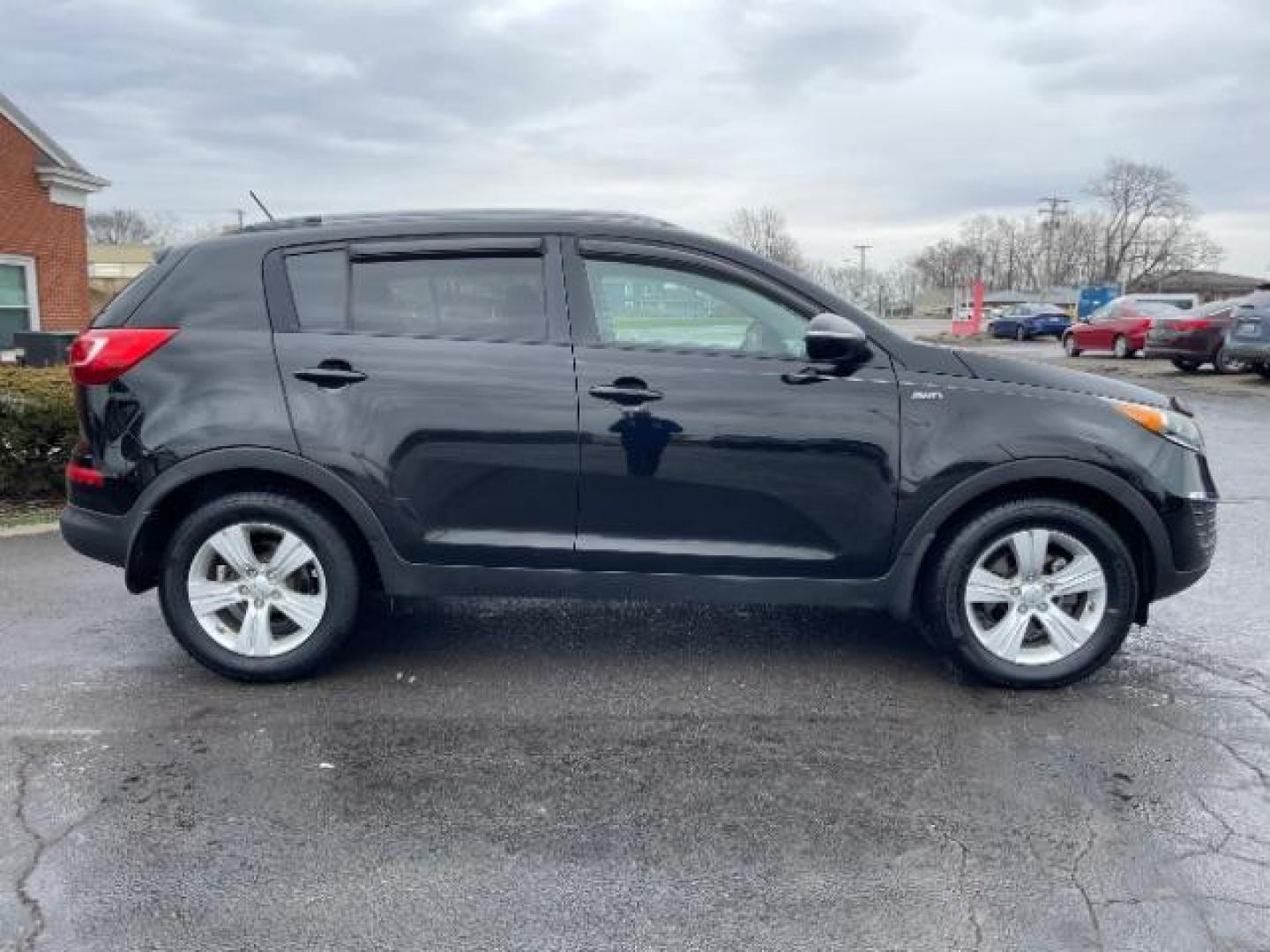 2013 Black Cherry Kia Sportage LX AWD (KNDPBCA28D7) with an 2.4L V6 DOHC 24V engine, 6-Speed Automatic transmission, located at 1184 Kauffman Ave, Fairborn, OH, 45324, (937) 908-9800, 39.807072, -84.030914 - Photo#3