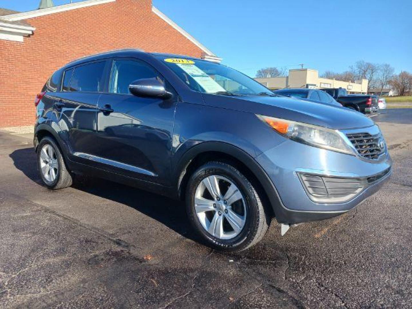 2013 Twilight Blue Kia Sportage LX FWD (KNDPB3A26D7) with an 2.4L V6 DOHC 24V engine, 6-Speed Automatic transmission, located at 1951 S Dayton Lakeview Rd., New Carlisle, OH, 45344, (937) 908-9800, 39.890999, -84.050255 - Photo#0